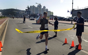 runner crossing the finish line